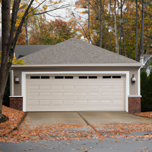 Residential sectional garage door on a Tewksbury, MA home with visible hardware and weather seals, overcast autumn day.